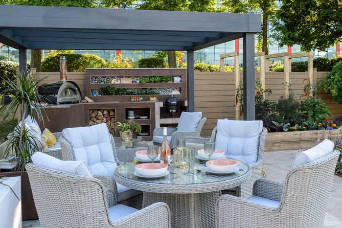 Outdoor kitchen beneath a pergola. Jason Ingram